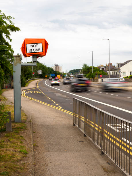 istock Cars passing a speed camera marked 