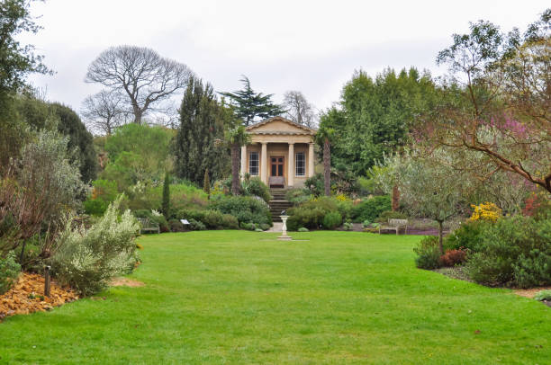 Pavilion in Kew botanical gardens in spring, London, UK London, UK - April 2018: Pavilion in Kew botanical gardens in spring kew gardens spring stock pictures, royalty-free photos & images