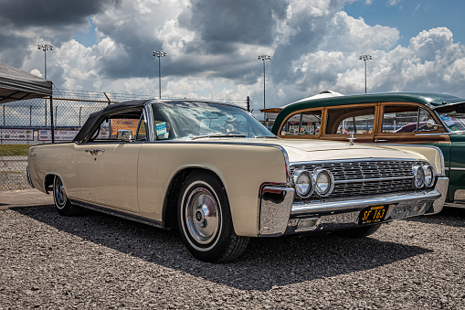Lebanon, TN - May 14, 2022: Wide perspetive front corner view of a 1962 Lincoln Continental Convertible at a local car show.