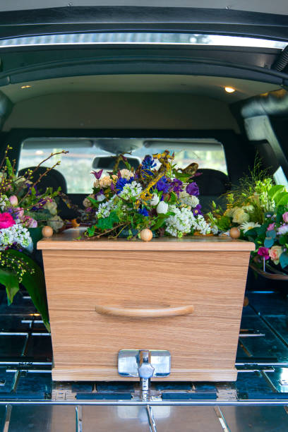istock Funeral Flowers in a hearse car 1409550555