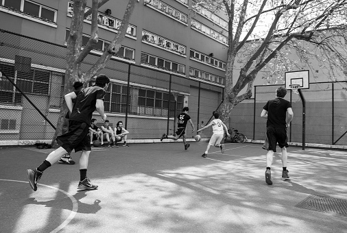 05-07-2022  Paris, France. Young men ( youth)  playing basketball  on special field  near Canal Saint-Martin)