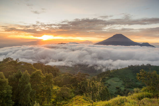 istock Golden Sunrise at Bukit Sikunir (Sikunir Hill) Dieng Central Java Indonesia. 1409552442