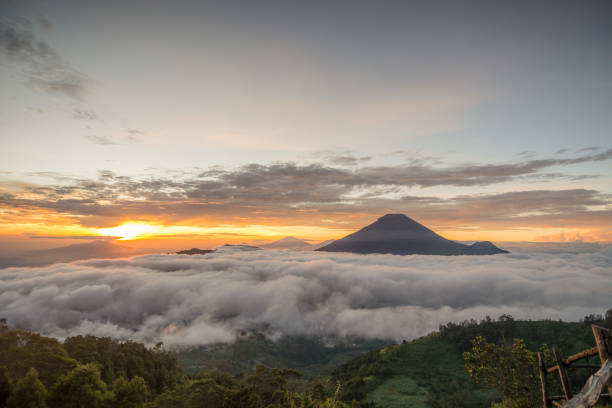 istock Golden Sunrise at Bukit Sikunir (Sikunir Hill) Dieng Central Java Indonesia. 1409552446