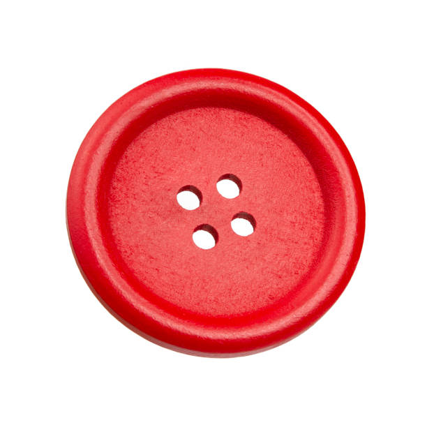 istock Red cloth button sew material isolated on the white background 1409553389