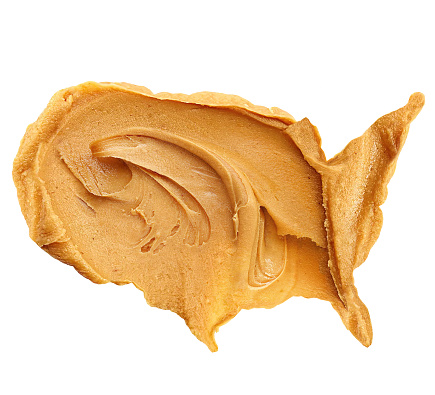 Peanut butter spread in USA shape on white background