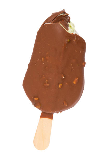 istock Chocolate glazed icecream escimo with nuts isolated on the white background 1409553678
