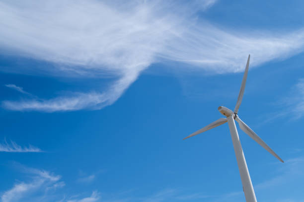 istock Windmill for electric power production with a blue sky 1409553777