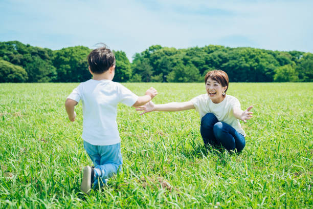 istock Mother hugging her boy in the green space 1409556389