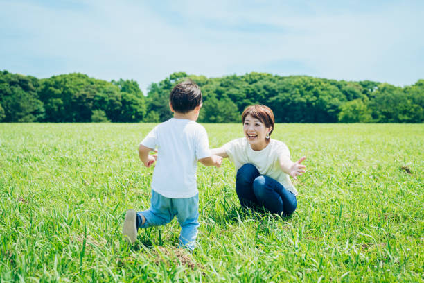 istock Mother hugging her boy in the green space 1409556615