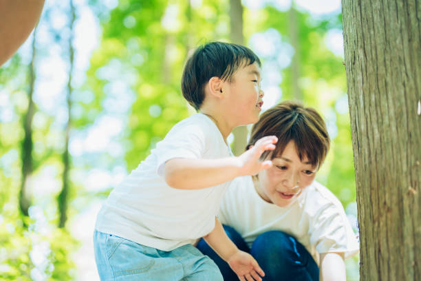istock Boy and parents exploring the woods 1409558077
