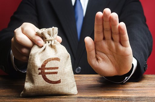 Businessman refuses to give European euro EUR money bag. Refusal to grant loan mortgage, bad credit history. Refuses cooperate. Financial difficulties. Economic sanctions, confiscation funds