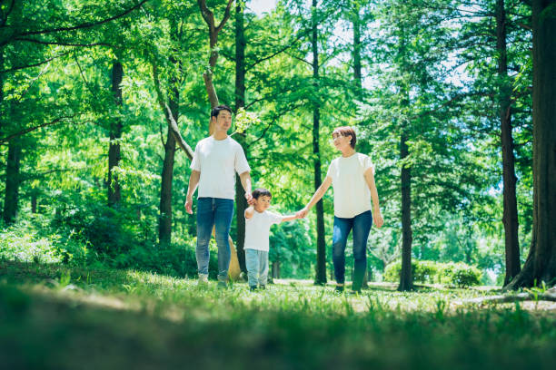 Parents and their child exploring the woods