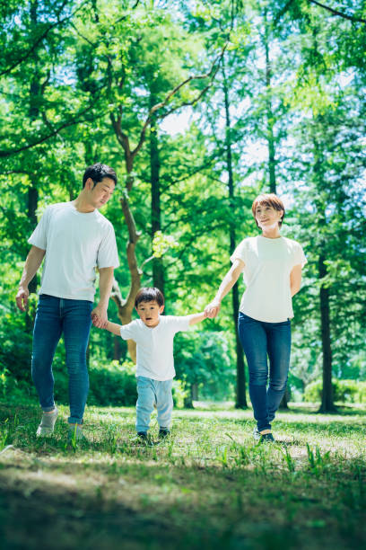 istock Parents and their child exploring the woods 1409561276