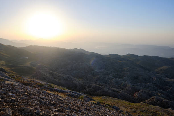 istock Scenic view of sunrise in a mountainside 1409563551