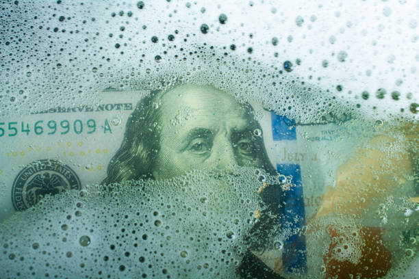 Wash Dollar Wash Dollar money laundering stock pictures, royalty-free photos & images