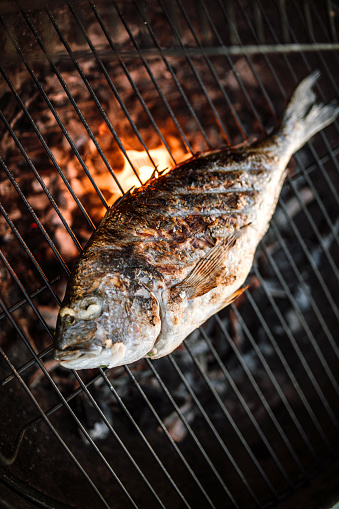 Sea bream on a grill. Delicious tasty fresh sea food