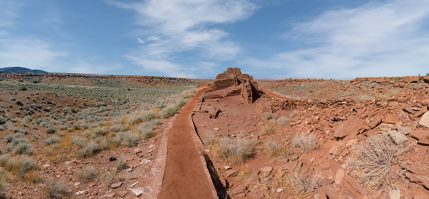 Between 1100AD and 1200AD native people inhabited the plains between the Painted Desert and the San Francisco Peaks of Arizona.  In an area so dry it would seem impossible to live, they built pueblos, harvested rainwater, grew crops and raised families.  Their way of life was the key to survival in this harsh landscape.  These people survived here, farming one of the warmest and driest places on the Colorado Plateau.  They developed the skills to farm the land and endure hardship in an area where many would not.  Today the remnants of their villages dot the landscape.  Wupatki Pueblo is in Wupatki National Monument, established in 1924 to preserve this rich heritage.  Wupatki National Monument is near Flagstaff, Arizona, USA.