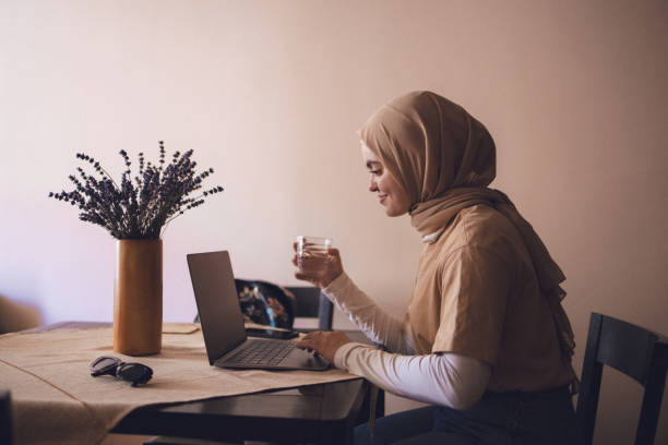 istock Young Arab woman using laptop 1409578340