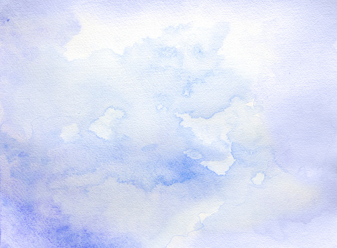 Abstract blue and purple soft watercolor background on a white paper.