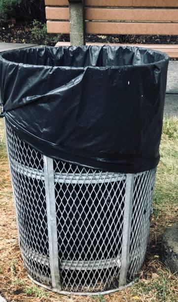 istock Metal Trash Can In Park 1409583241