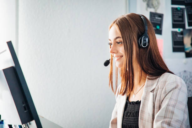 Smiling Businesswoman in a Video Call with Headset stock photo