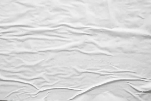 istock white crumpled and creased paper poster texture background 1409590247
