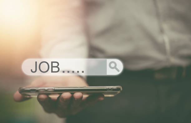 istock job search bar graphic on phone hold by man 1409591374