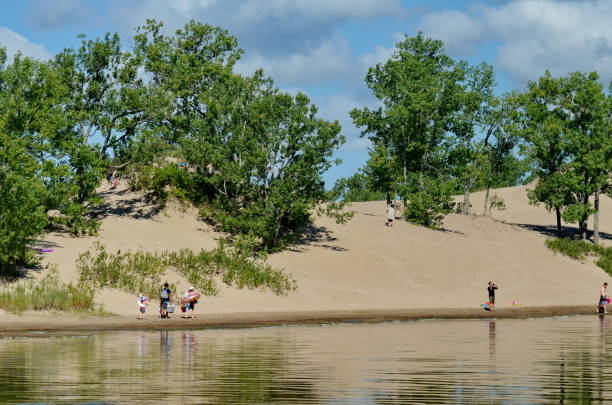 People enjoy the Dunes beach at Sandbanks Provincial Park Prince Edward County, Ontario, Canada, July 14, 2022: People enjoy the Dunes beach at Sandbanks Provincial Park. Sandbanks is located on the north-east side of Lake Ontario. sandbanks ontario stock pictures, royalty-free photos & images