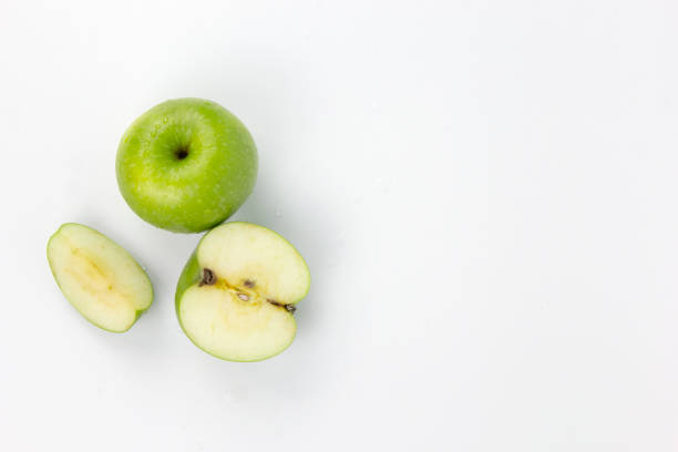 istock Set of Sliced Fresh Green Apple Isolated on White Background 1409597668