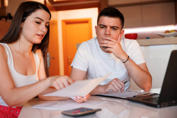 istock Worried young couple managing their home budget 1409602141