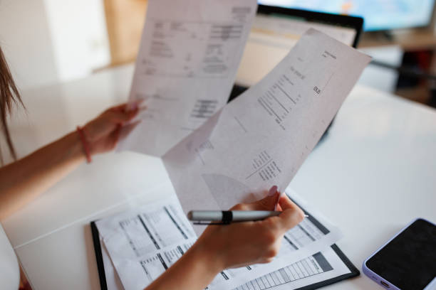 istock Woman paying bills from home 1409603062