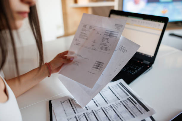 istock Woman paying bills from home 1409603081