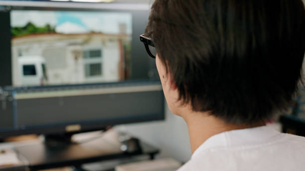 istock Young man editing video at the office. 1409603600