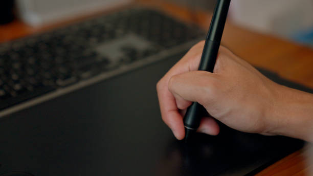 ペンタブレットを使う青年。 - business person technology digital tablet using computer ストックフォトと画像