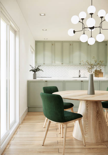 istock 3d rendering kitchen and dining room interior design and decoration with built in light green counter and cabinets, wooden dining table and green chairs, wooden parquet floor and sunlight from window 1409606595