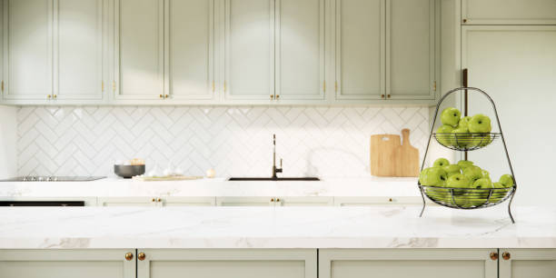 istock 3d rendering mockup light green kitchen room interior design and decoration with built in marble countertop and green cabinets, sink and faucet, electric stove. 1409606615
