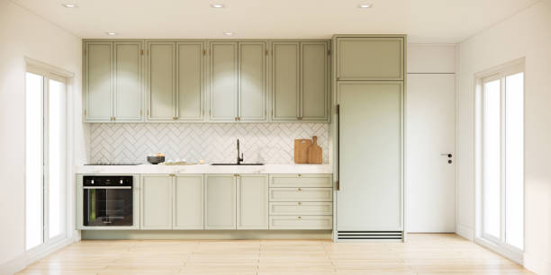 istock Mock up modern white kitchen room interior design and decoration with built in light green counter and cabinets parquet floor and sunlight from window. 3d rendering kitchen. 1409606650