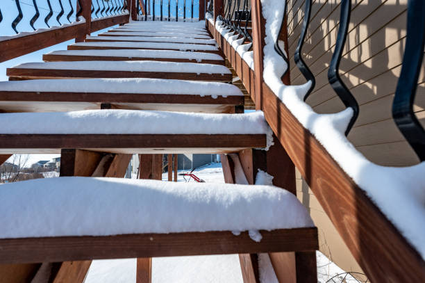 istock Snow covered wooden steps on a residential house 1409610558