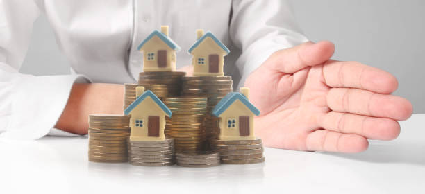 istock House Residential Structure in  hand 1409613638