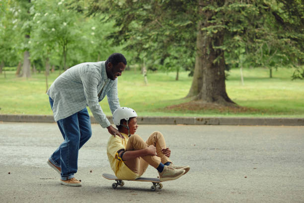 istock Dad having fun with his son in park 1409614624