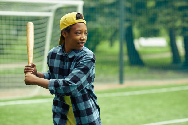 istock African boy learning to hi the ball in baseball 1409614682