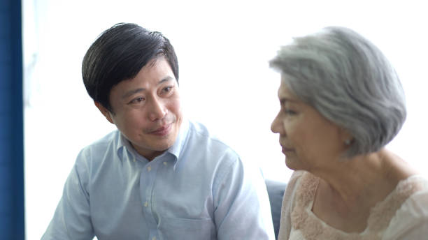 istock Man talking to elder woman. 1409615522