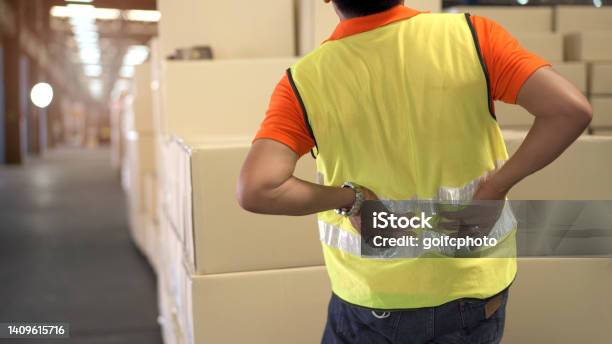Worker Get Hurt At Back Stock Photo - Download Image Now - Picking Up, Working, Occupation