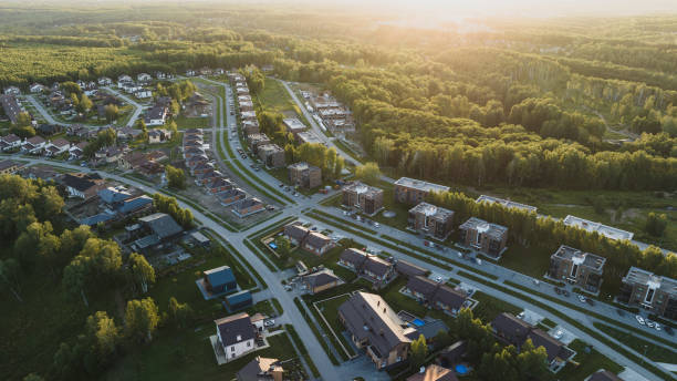 Small modern village in summer at sunset. Aerial view stock photo