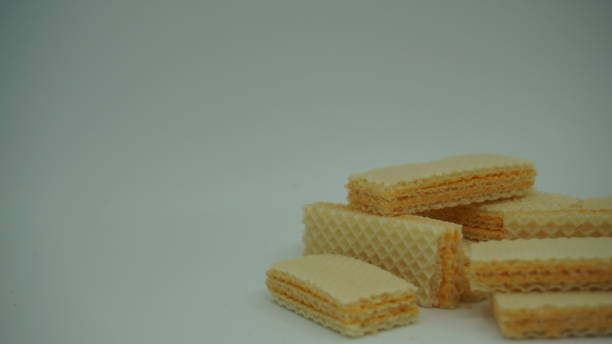 istock Tasty wafer sticks on white background 1409616456