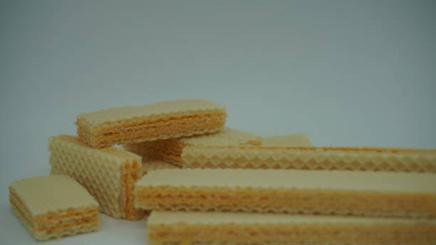 istock Tasty wafer sticks on white background 1409616457