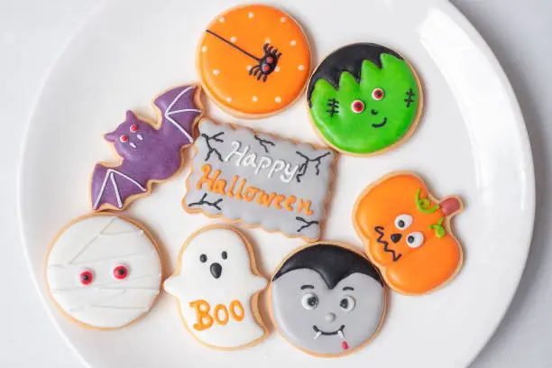 Photo of Happy Halloween with funny Cookies; Pumpkin, scary ghost, spooky mummy, bat, frankenstein, dracula and spider. Trick or Threat, Hello October, fall autumn, Traditional, party and holiday concept