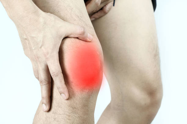 istock knee pain man He puts his hands on his knees, pain points from osteoarthritis and bone diseases, medical concepts and treatments. 1409622807