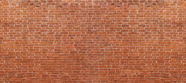 Photo of Abstract red brick wall panoramic background