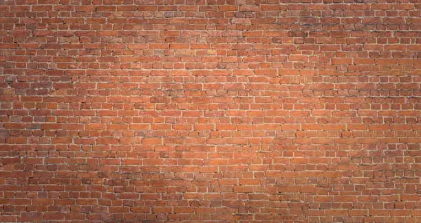 Photo of Abstract red brick wall panoramic background
